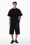 Alexander Wang black overdyed stripe schwarz gestreiftes poloshirt aus baumwollpikee