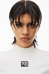 alexander wang logo patch mock neck top in bodycon knit  soft white