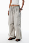 Alexander Wang stone grey parachute pants with logo print